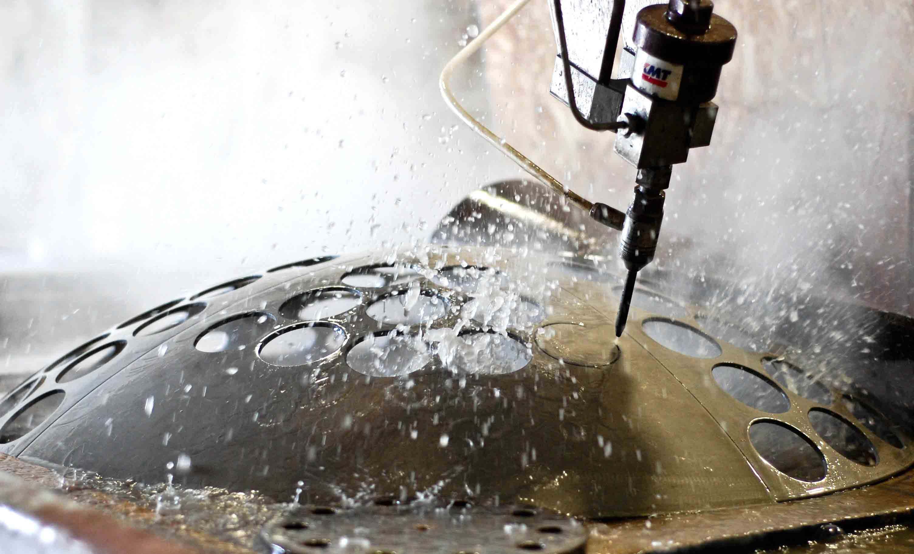 Waterjet cutting nested profiles from metal sheet