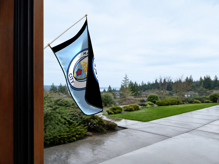 Manchester City Authentic Gameday Flag — approved one-scene environment view — EXO R89 — item_id=euro-soccer-manchester-city — source_sha256=103528e95a834b3e076ca2527ad503d12f66350d341aef327105d18978fa3c52