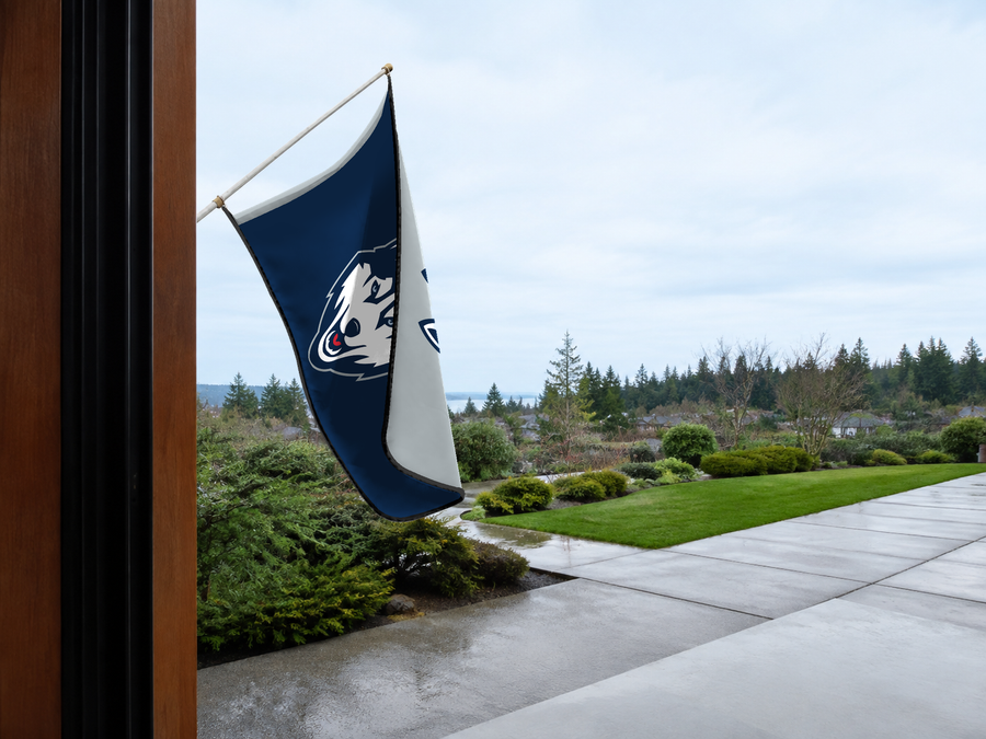 UConn Huskies Authentic Gameday Flag — approved one-scene environment view — EXO R89 — item_id=ncaa-fbs-uconn-huskies — source_sha256=5281c1974b339d2759c9cb8ae042fa0c4d612d181199c2ca892612e5d9b20481