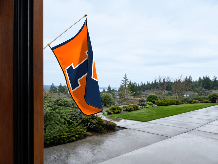 Illinois Fighting Illini Authentic Gameday Flag — approved one-scene environment view — EXO R89 — item_id=ncaa-fbs-illinois-fighting-illini — source_sha256=63b7ebc7fdea78ef182e0ad41574116d871ebdf013d0cf581bc1fb81c038a6ee