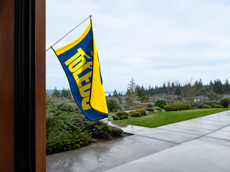 Toledo Rockets Authentic Gameday Flag — approved one-scene environment view — EXO R89 — item_id=ncaa-fbs-toledo-rockets — source_sha256=807d12d4ab6d2705e24477834eedd7baadd837eaf5006f7f63786ceb12e21476