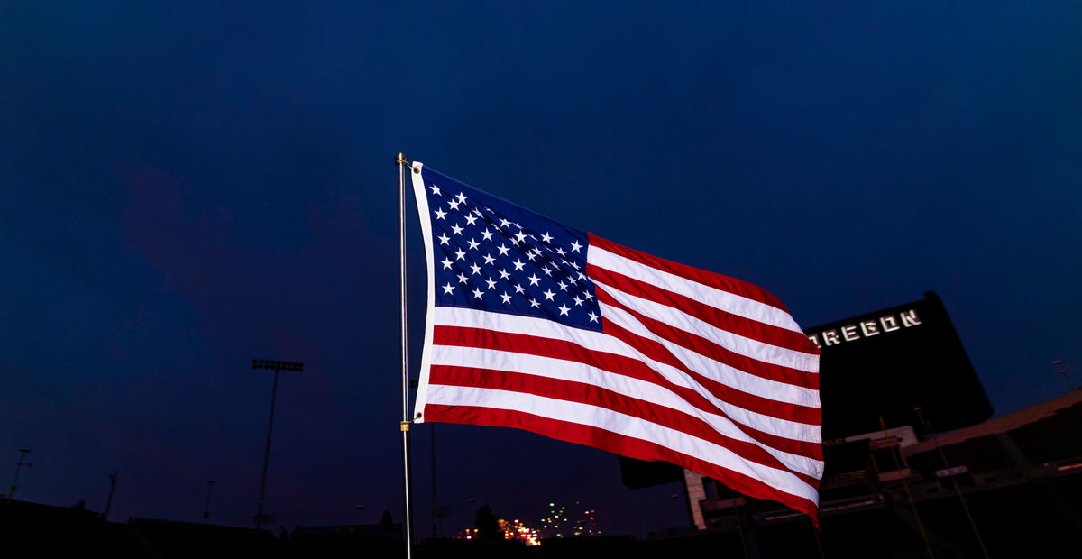 EXO PHOTOGRAPHY / EDER USA FLAG / FIELD MOTION / full United States flag flying at a stadium / real product photography