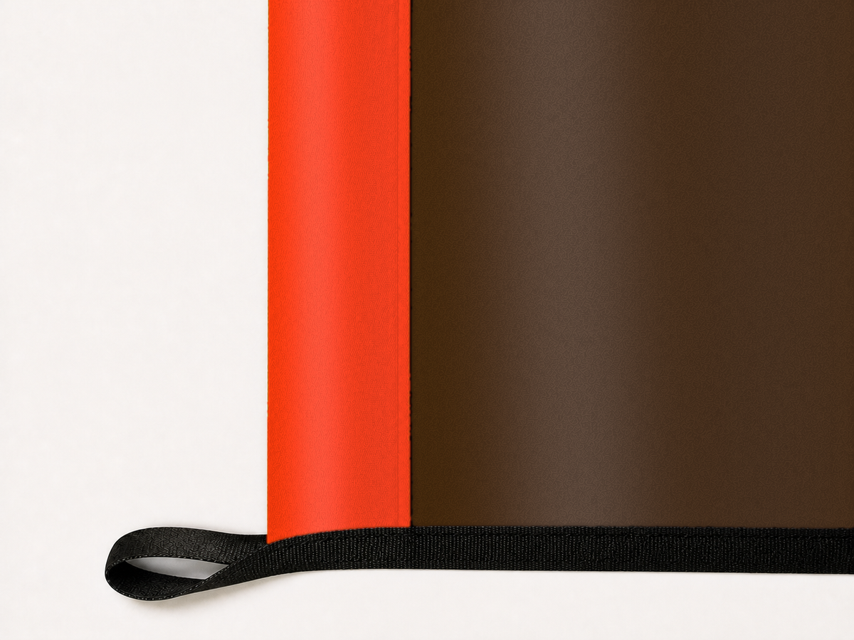 Cleveland Browns Authentic Gameday Flag underside and personalization construction view — continuous restrained woven-satin Cleveland Browns Accent header, textured Cleveland Browns Primary face, lower black loop and perimeter webbing — source_sha256=5e8268b844b1720b3fc9174d753c5429306bf16dd7ed56aeb20fb33b47b2127f