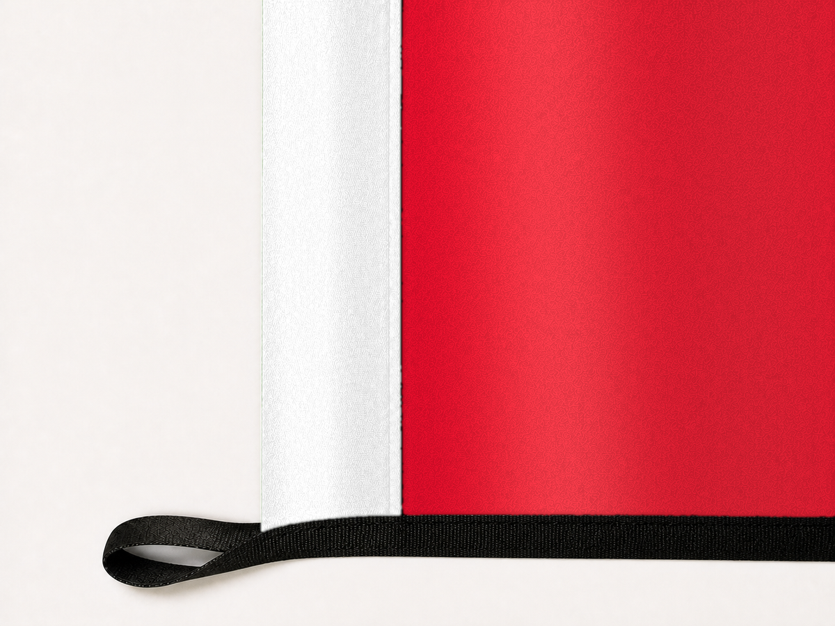 AC Milan Authentic Gameday Flag underside and personalization construction view — continuous restrained woven-satin AC Milan Accent header, textured AC Milan Primary face, lower black loop and perimeter webbing — source_sha256=1ff6201507cafba7288c0bc7c3a729a6ce5852c0680ada6cac1320bdead1bc4f