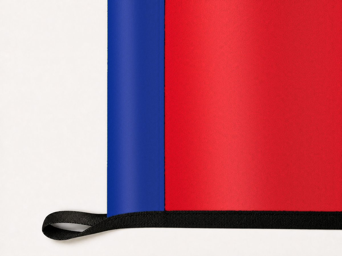Arsenal Authentic Gameday Flag underside and personalization construction view — continuous restrained woven-satin Arsenal Accent header, textured Arsenal Primary face, lower black loop and perimeter webbing — source_sha256=14e3255b17b34334f6107e22bba3bf63acd46f2351d0d870d60de8f6df686713