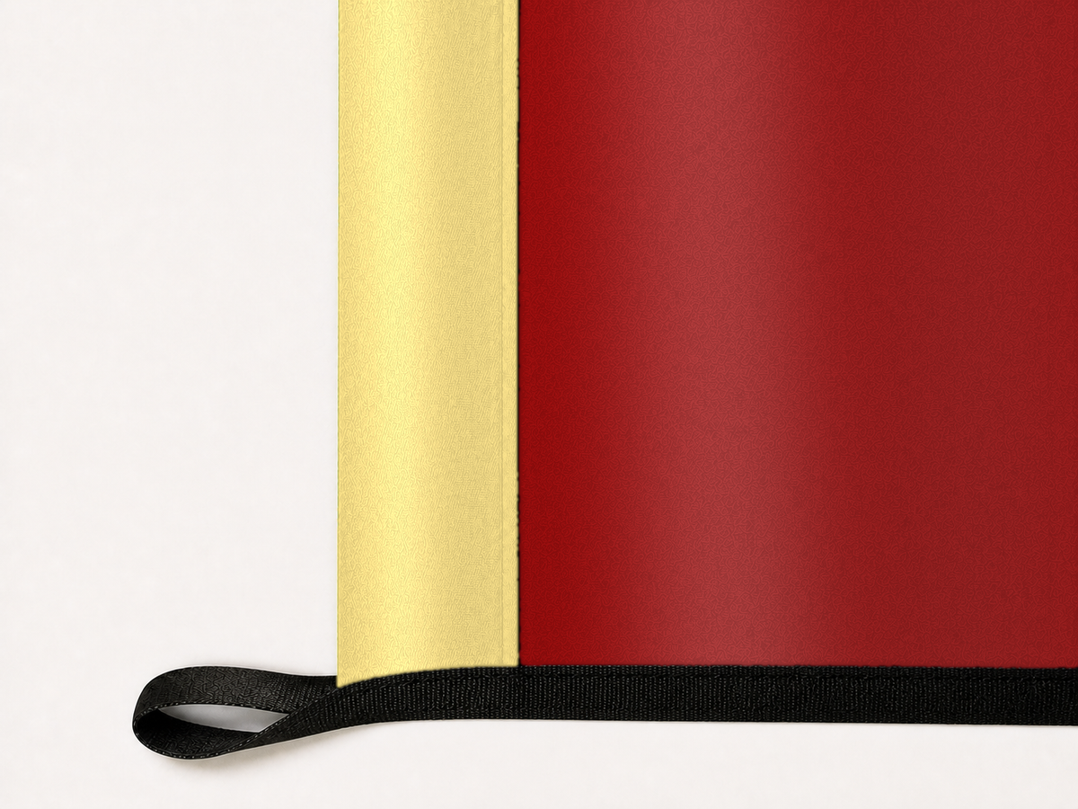 Barcelona Authentic Gameday Flag underside and personalization construction view — continuous restrained woven-satin Barcelona Accent header, textured Barcelona Primary face, lower black loop and perimeter webbing — source_sha256=e6ab9413762e172605874354336bab078078eec57ae827a441e9008dff28d1d2