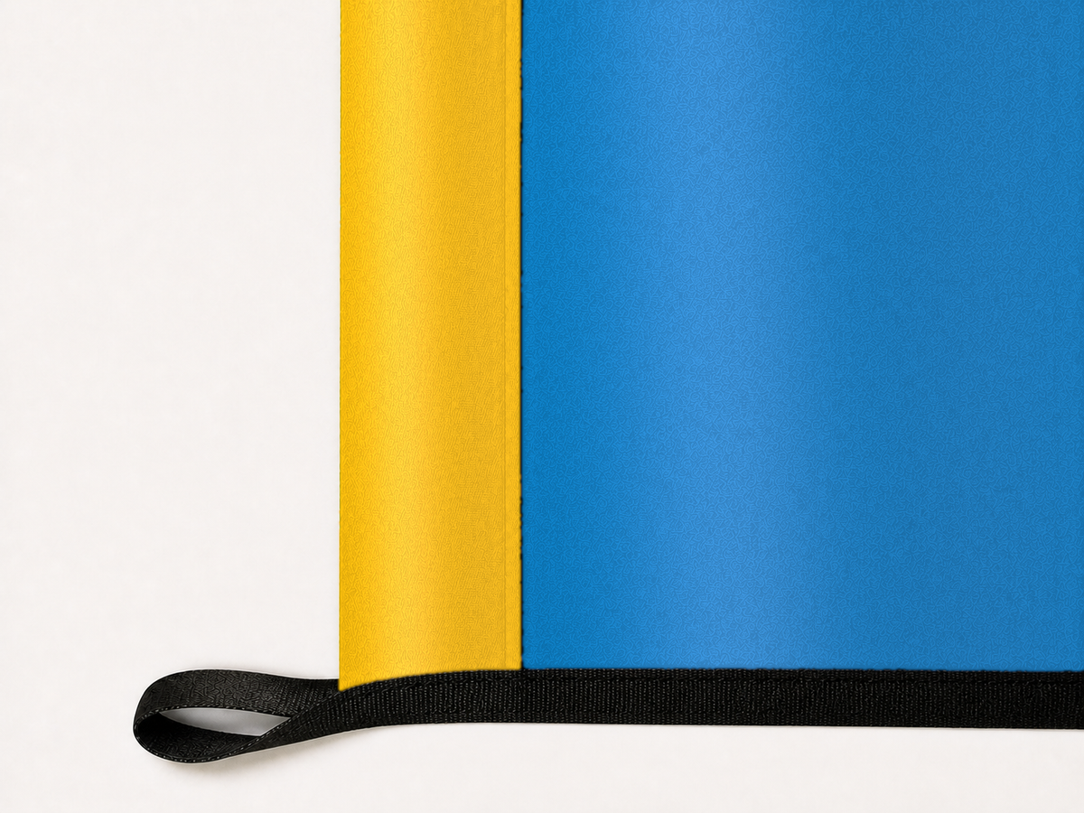 Los Angeles Chargers Authentic Gameday Flag underside and personalization construction view — continuous restrained woven-satin Los Angeles Chargers Accent header, textured Los Angeles Chargers Primary face, lower black loop and perimeter webbing — source_sha256=93b69cabd76b132ff8095f4ae60f7c48142797e067baa48cc04992feb14490bc