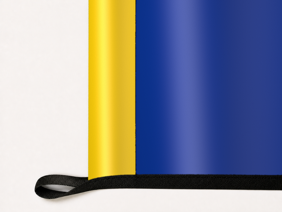 Los Angeles Rams Authentic Gameday Flag underside and personalization construction view — continuous restrained woven-satin Los Angeles Rams Accent header, textured Los Angeles Rams Primary face, lower black loop and perimeter webbing — source_sha256=32b4267910512ffdcaa25ee1bd795a9444c944b3f24ba4bfe80ad1593ca7caf3