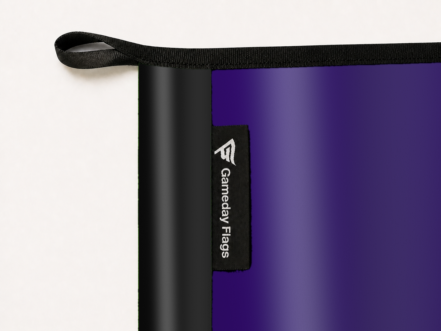 Colorado Rockies Authentic Gameday Flag construction detail — restrained woven-satin Colorado Rockies Accent sewn header, textured Colorado Rockies Primary face, woven Gameday Flags tag, black loop, perimeter webbing, and stitching — source_sha256=9b8eec3158fecce6c473cb33e71965cf42df2607e9ee3fd5cc13bb18dc9927b3