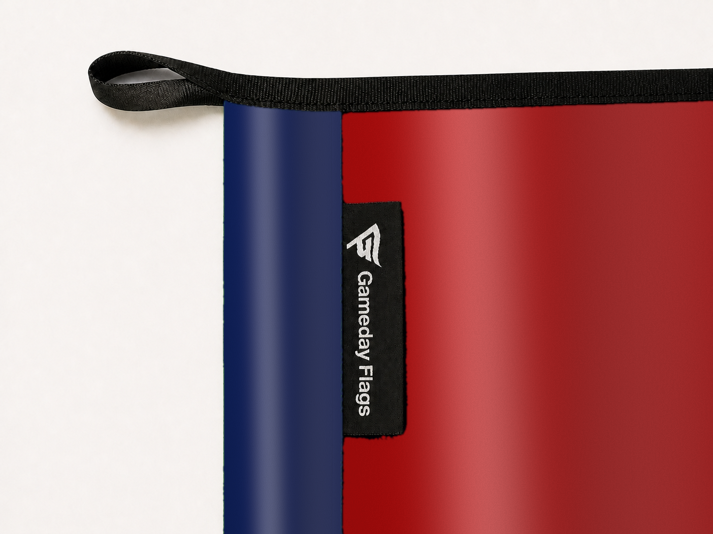 Washington Nationals Authentic Gameday Flag construction detail — restrained woven-satin Washington Nationals Accent sewn header, textured Washington Nationals Primary face, woven Gameday Flags tag, black loop, perimeter webbing, and stitching — source_sha256=d0009045aecd431ef96475ed669c29f1762169f23ecaca3ef743b73f685ab1c6