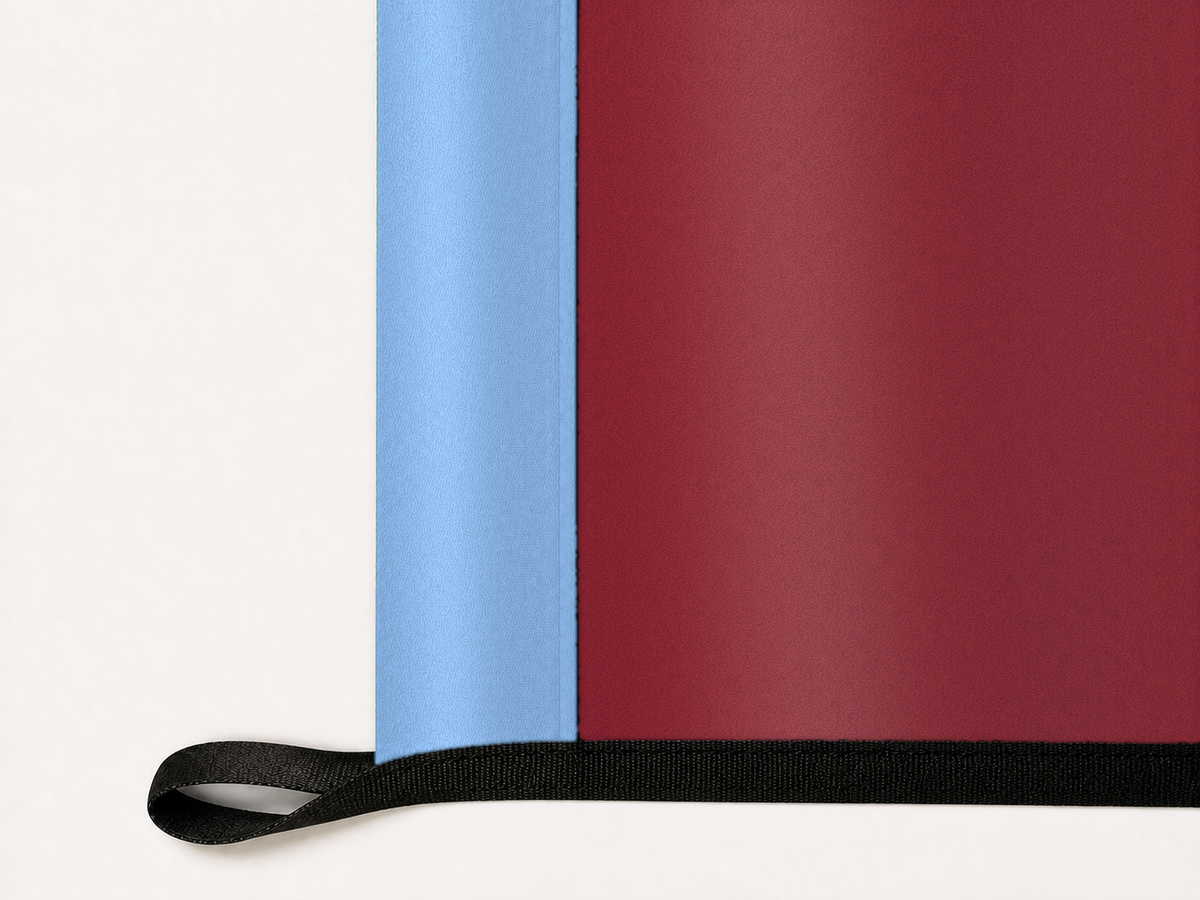 Colorado Rapids Authentic Gameday Flag underside and personalization construction view — continuous restrained woven-satin Colorado Rapids Accent header, textured Colorado Rapids Primary face, lower black loop and perimeter webbing — source_sha256=3b3bb0504ace4473b04b02f08fc09e0eeb1479afe1a3d13b75f6e401fb694995