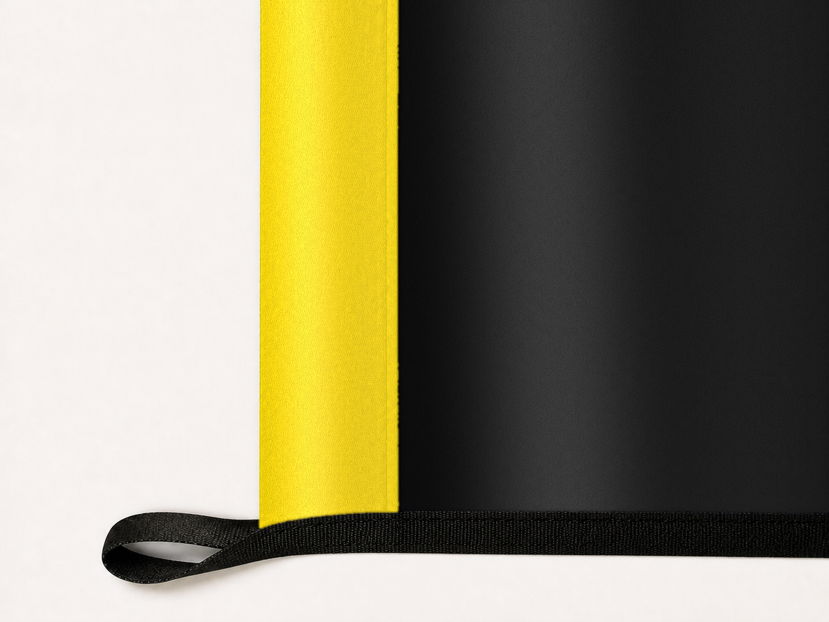 Columbus Crew Authentic Gameday Flag underside and personalization construction view — continuous restrained woven-satin Columbus Crew Accent header, textured Columbus Crew Primary face, lower black loop and perimeter webbing — source_sha256=a0a4a3d2cdb653356e934dc7e84eb697a4918015d8a9d6e53ed0f058f7538880