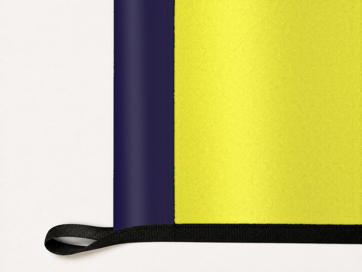 Nashville SC Authentic Gameday Flag underside and personalization construction view — continuous restrained woven-satin Nashville SC Accent header, textured Nashville SC Primary face, lower black loop and perimeter webbing — source_sha256=a8fb0bfa55c5610a7f60f0a8ede77c739d8c48fd79d493522ac7e1b505403581