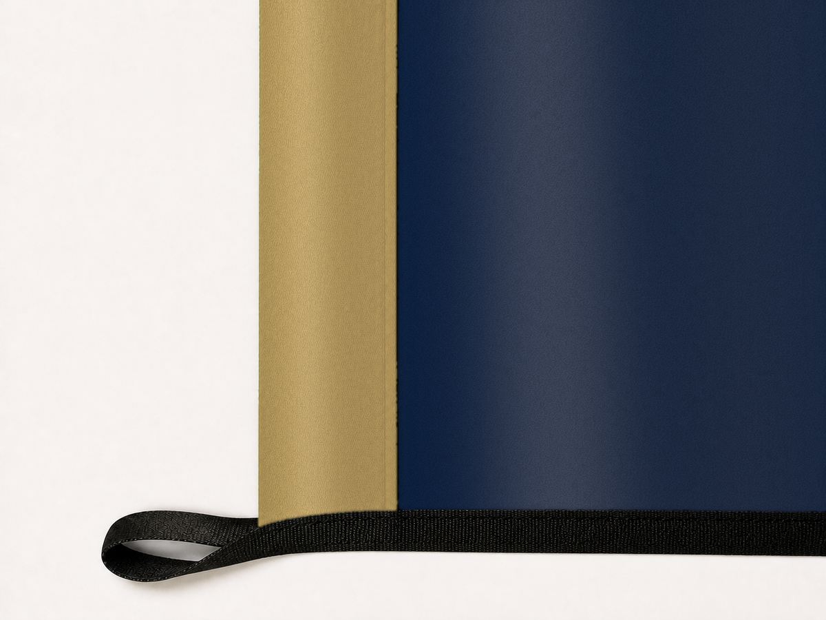 New Orleans Pelicans Authentic Gameday Flag underside and personalization construction view — continuous restrained woven-satin New Orleans Pelicans Accent header, textured New Orleans Pelicans Primary face, lower black loop and perimeter webbing — source_sha256=b1c452b018ed2f0cd8c43ed5efb284c0a048649383e7e61c32a1ffe676f1b5a1