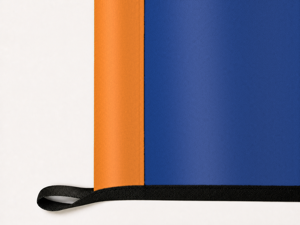 New York Knicks Authentic Gameday Flag underside and personalization construction view — continuous restrained woven-satin New York Knicks Accent header, textured New York Knicks Primary face, lower black loop and perimeter webbing — source_sha256=8f5181b6dff0b26e9bce48c091eb965e2b456a93763059bbca72d841bc6903c6