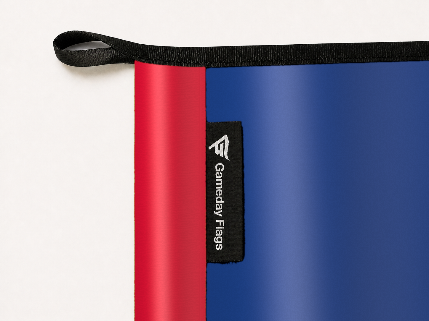 Philadelphia 76ers Authentic Gameday Flag construction detail — restrained woven-satin Philadelphia 76ers Accent sewn header, textured Philadelphia 76ers Primary face, woven Gameday Flags tag, black loop, perimeter webbing, and stitching — source_sha256=3af81cd41a7cc2d40570b3139ee642c936c91cdc3a05580c1c4c0d4dfa758556
