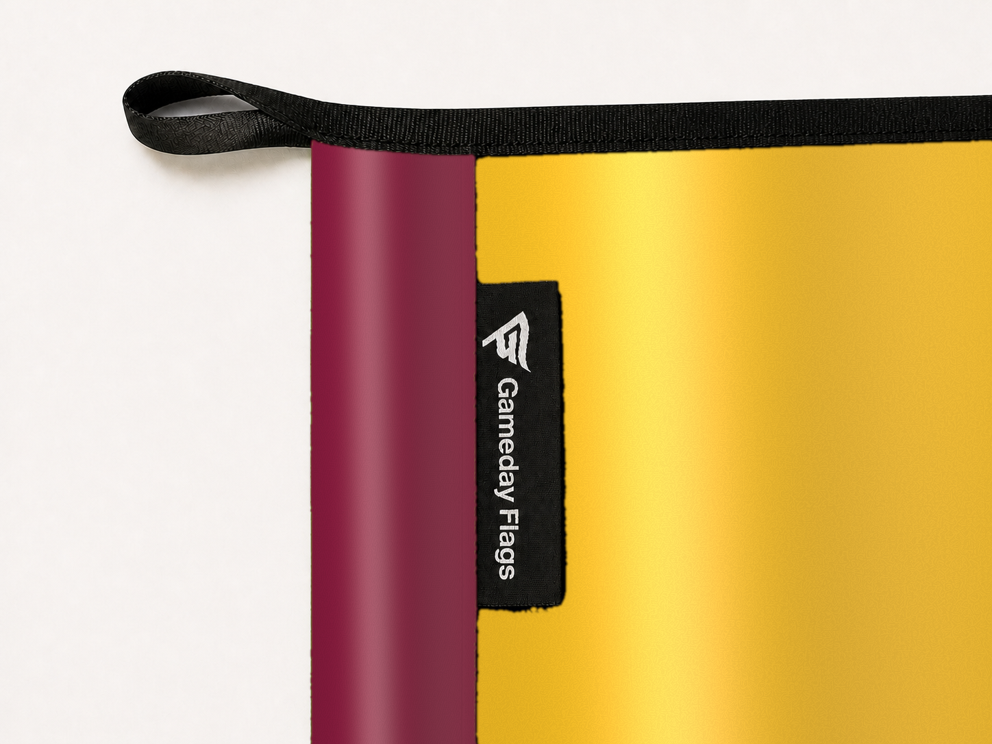 Arizona State Sun Devils Authentic Gameday Flag construction detail — restrained woven-satin Arizona State Sun Devils Accent sewn header, textured Arizona State Sun Devils Primary face, woven Gameday Flags tag, black loop, perimeter webbing, and stitching — source_sha256=112e05458001ca8fef6910352e0fef6158ac089afb8fbe8e1892fd84e8155f2f