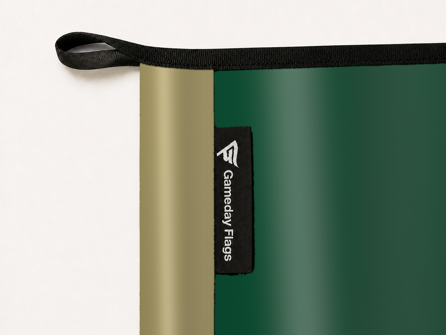 Charlotte 49ers Authentic Gameday Flag construction detail — restrained woven-satin Charlotte 49ers Accent sewn header, textured Charlotte 49ers Primary face, woven Gameday Flags tag, black loop, perimeter webbing, and stitching — source_sha256=280f5ab25180b60e3064821c170bbdb163d74fda7e6f2b2002906e976c3fd614