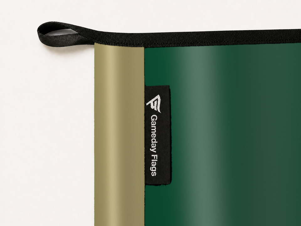 Charlotte 49ers Authentic Gameday Flag construction detail — restrained woven-satin Charlotte 49ers Accent sewn header, textured Charlotte 49ers Primary face, woven Gameday Flags tag, black loop, perimeter webbing, and stitching — source_sha256=280f5ab25180b60e3064821c170bbdb163d74fda7e6f2b2002906e976c3fd614