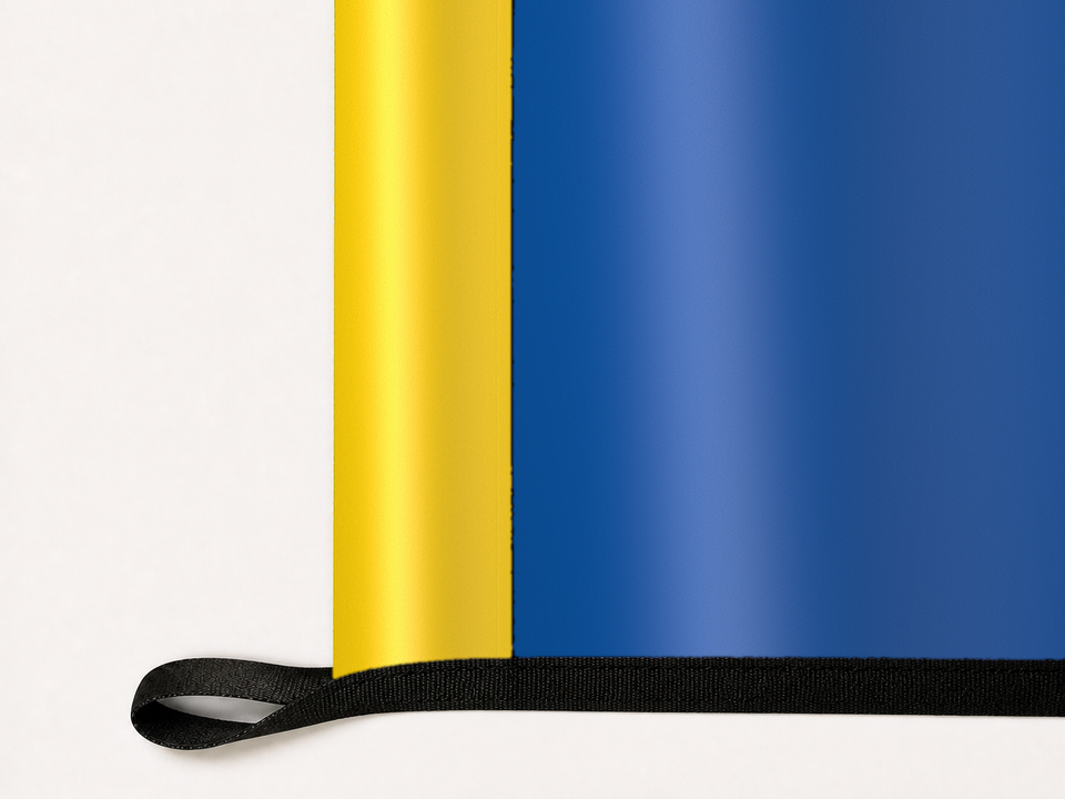 Delaware Blue Hens Authentic Gameday Flag underside and personalization construction view — continuous restrained woven-satin Delaware Blue Hens Accent header, textured Delaware Blue Hens Primary face, lower black loop and perimeter webbing — source_sha256=515709b3255f2623fc52ca3e9978196683be2bf3f0b570bd8ed587e80227240c