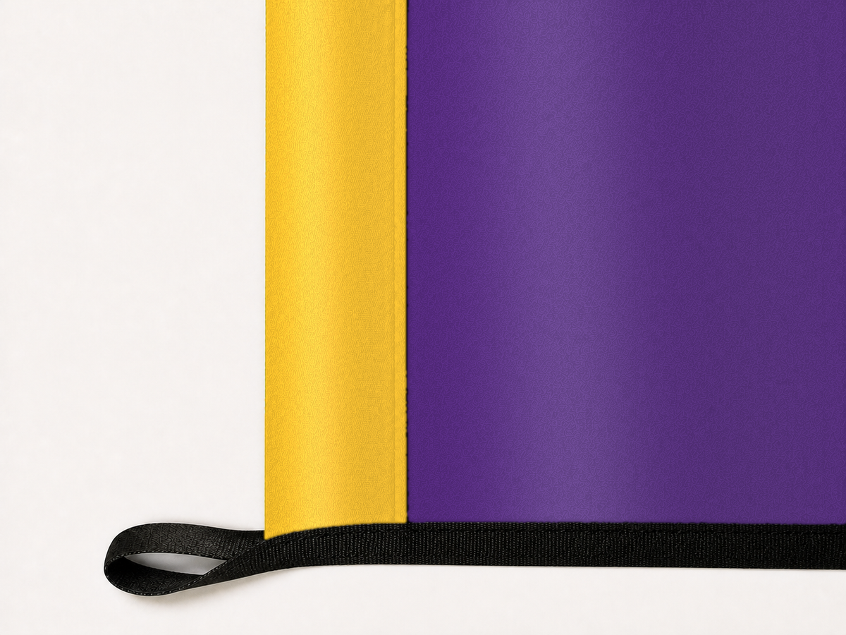 East Carolina Pirates Authentic Gameday Flag underside and personalization construction view — continuous restrained woven-satin East Carolina Pirates Accent header, textured East Carolina Pirates Primary face, lower black loop and perimeter webbing — source_sha256=6a9a085f149026f325a6b6070c69d94438a74e943674ecc4c24f1d873fe83484