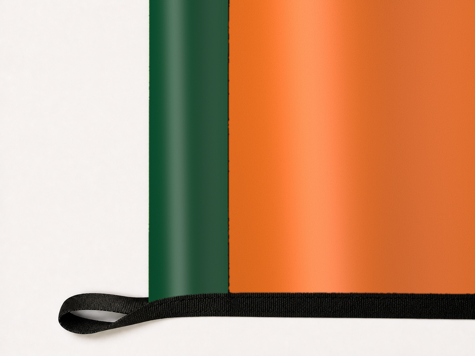 Miami Hurricanes Authentic Gameday Flag underside and personalization construction view — continuous restrained woven-satin Miami Hurricanes Accent header, textured Miami Hurricanes Primary face, lower black loop and perimeter webbing — source_sha256=ebceb35094f57cfa57a66817d2c3b284ddd0d5a25aff783384471840c3ddcbae