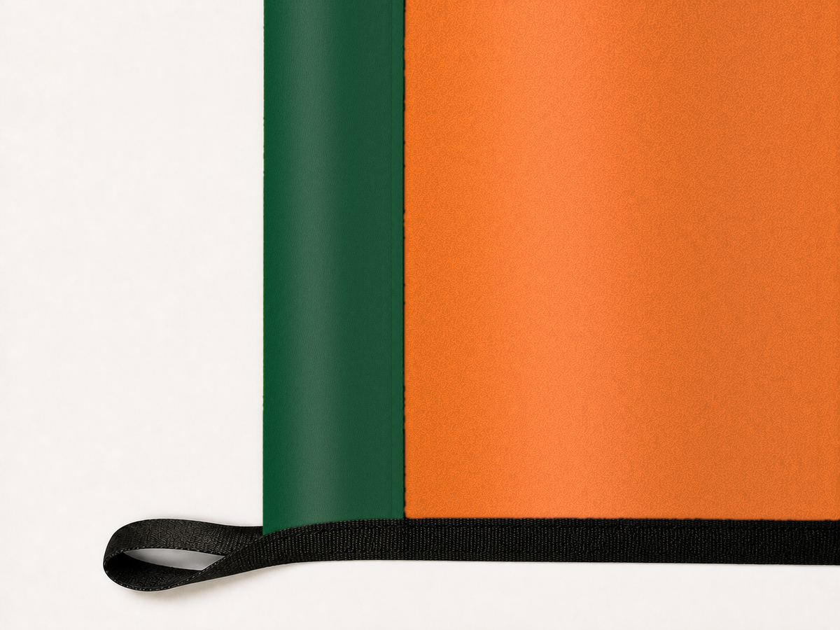 Miami Hurricanes Authentic Gameday Flag underside and personalization construction view — continuous restrained woven-satin Miami Hurricanes Accent header, textured Miami Hurricanes Primary face, lower black loop and perimeter webbing — source_sha256=715f0096f2784a281ce963ce48093ce45b6d5592edd13fdf1b0c935daa4b4b92