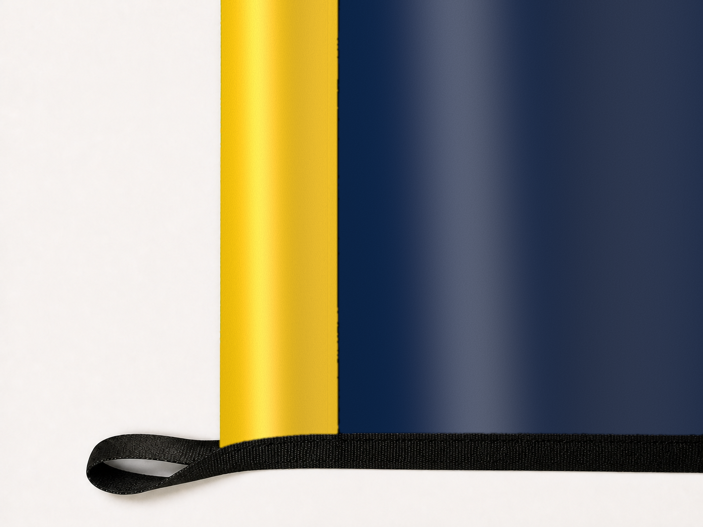 Michigan Wolverines Authentic Gameday Flag underside and personalization construction view — continuous restrained woven-satin Michigan Wolverines Accent header, textured Michigan Wolverines Primary face, lower black loop and perimeter webbing — source_sha256=5f330b66a98984c9163ab5f2bc20c280608ae483945d2c49a569175c27c445fe