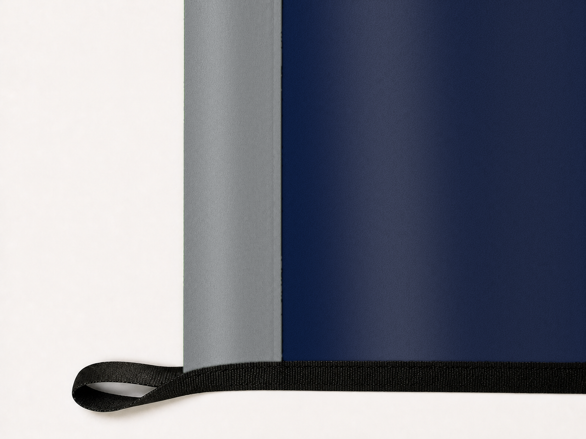 Nevada Wolf Pack Authentic Gameday Flag underside and personalization construction view — continuous restrained woven-satin Nevada Wolf Pack Accent header, textured Nevada Wolf Pack Primary face, lower black loop and perimeter webbing — source_sha256=9bc212af92ec408bba7be5fd611fe6d6686debcef007344897cbca21cd05a2bc