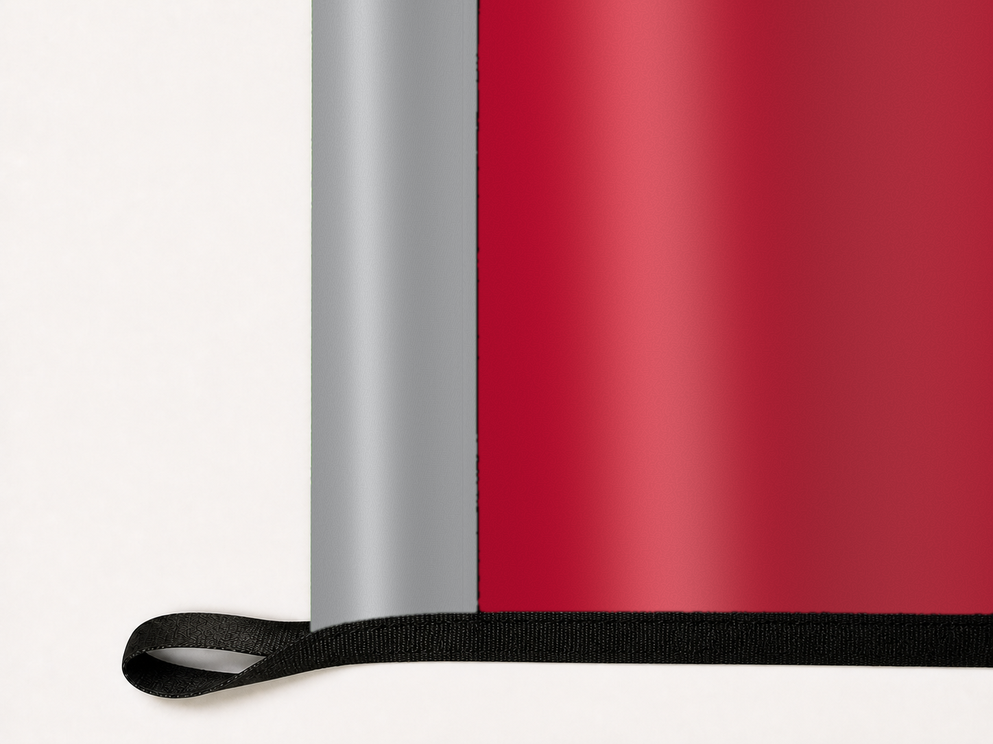 New Mexico Lobos Authentic Gameday Flag underside and personalization construction view — continuous restrained woven-satin New Mexico Lobos Accent header, textured New Mexico Lobos Primary face, lower black loop and perimeter webbing — source_sha256=43cddd9044b755014978f05e430a691d20fc7c19864d77313019eed3cd20831a