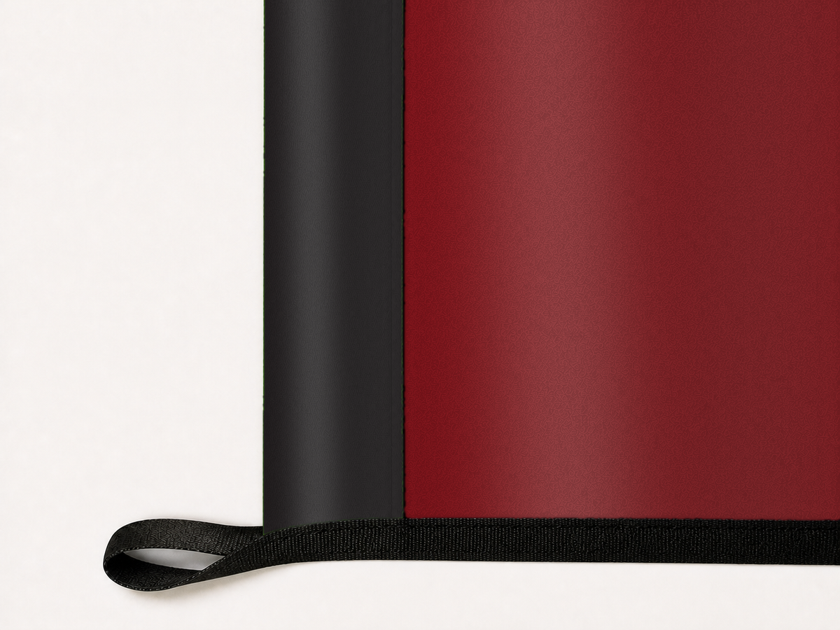 New Mexico State Aggies Authentic Gameday Flag underside and personalization construction view — continuous restrained woven-satin New Mexico State Aggies Accent header, textured New Mexico State Aggies Primary face, lower black loop and perimeter webbing — source_sha256=9198e73bb536c679eec3e0d05d8a8ee7055faa3b181f5adee5e8eef1baec0cf9