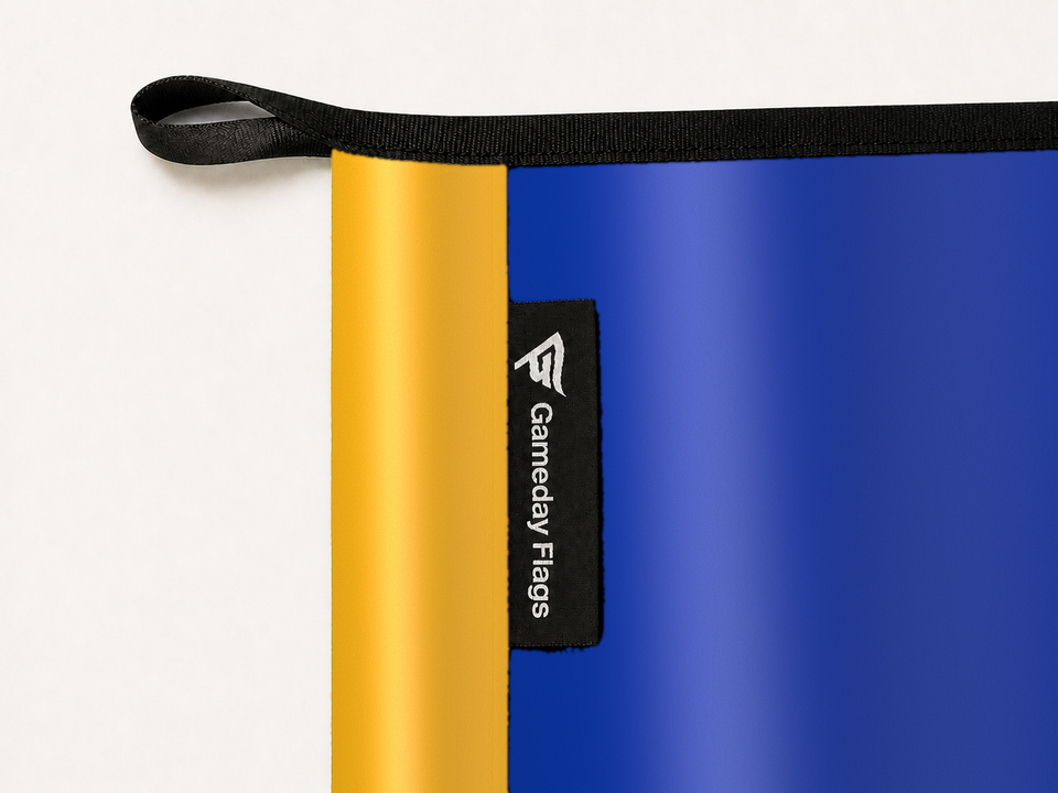 San José State Spartans Authentic Gameday Flag construction detail — restrained woven-satin San José State Spartans Accent sewn header, textured San José State Spartans Primary face, woven Gameday Flags tag, black loop, perimeter webbing, and stitching — source_sha256=65ad382230f8939a7e3121c8b1e4c0ad4f32475d9849fc12069a345b9cecfab9