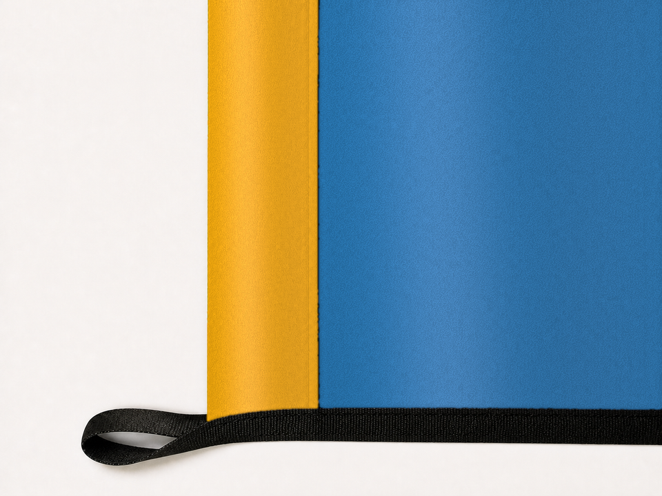 UCLA Bruins Authentic Gameday Flag underside and personalization construction view — continuous restrained woven-satin UCLA Bruins Accent header, textured UCLA Bruins Primary face, lower black loop and perimeter webbing — source_sha256=821fae8011db4a15dc6f845357b3148a3cb09cf2f254ecf3e70bc8adbfa444dd
