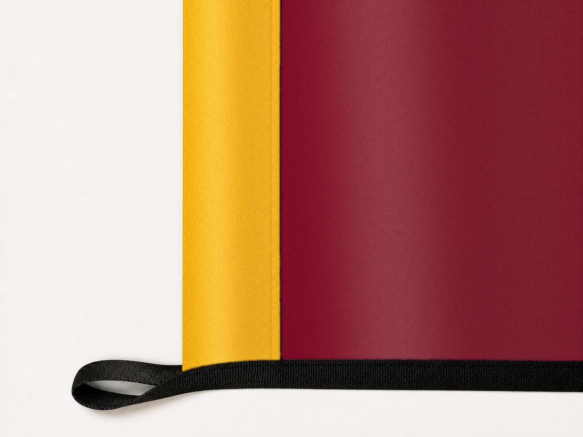 UL Monroe Warhawks Authentic Gameday Flag underside and personalization construction view — continuous restrained woven-satin UL Monroe Warhawks Accent header, textured UL Monroe Warhawks Primary face, lower black loop and perimeter webbing — source_sha256=cd1fd56566d86d8efe5b95b7ed6380e09c36a96c056e1d7c8de76dbfee3fcc6b