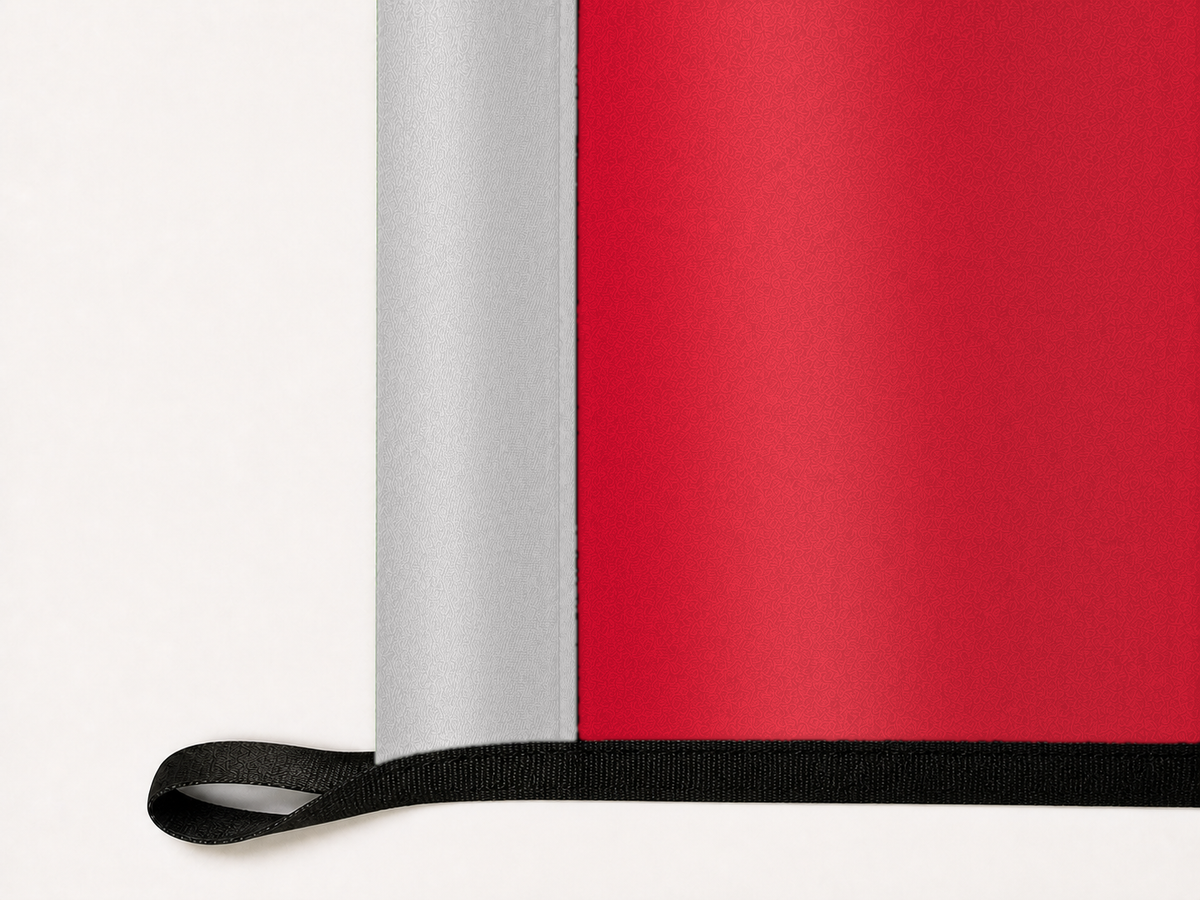 UNLV Rebels Authentic Gameday Flag underside and personalization construction view — continuous restrained woven-satin UNLV Rebels Accent header, textured UNLV Rebels Primary face, lower black loop and perimeter webbing — source_sha256=5b40f340cdbf4d869197bae8c856e98edac1356799269f1038ea03a5855bf81c