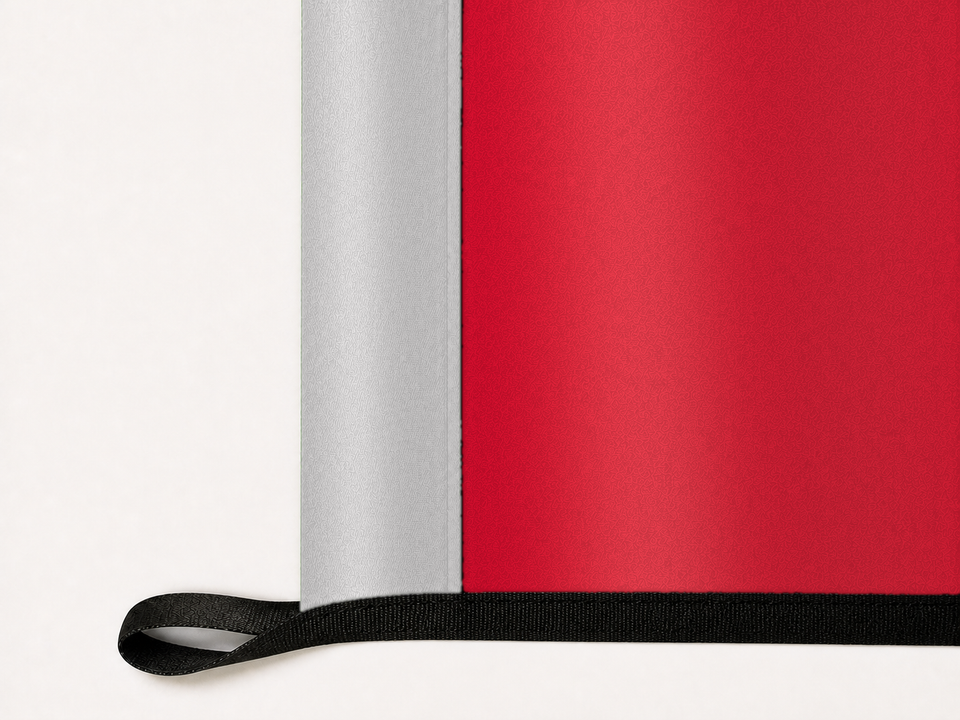 UNLV Rebels Authentic Gameday Flag underside and personalization construction view — continuous restrained woven-satin UNLV Rebels Accent header, textured UNLV Rebels Primary face, lower black loop and perimeter webbing — source_sha256=5b40f340cdbf4d869197bae8c856e98edac1356799269f1038ea03a5855bf81c