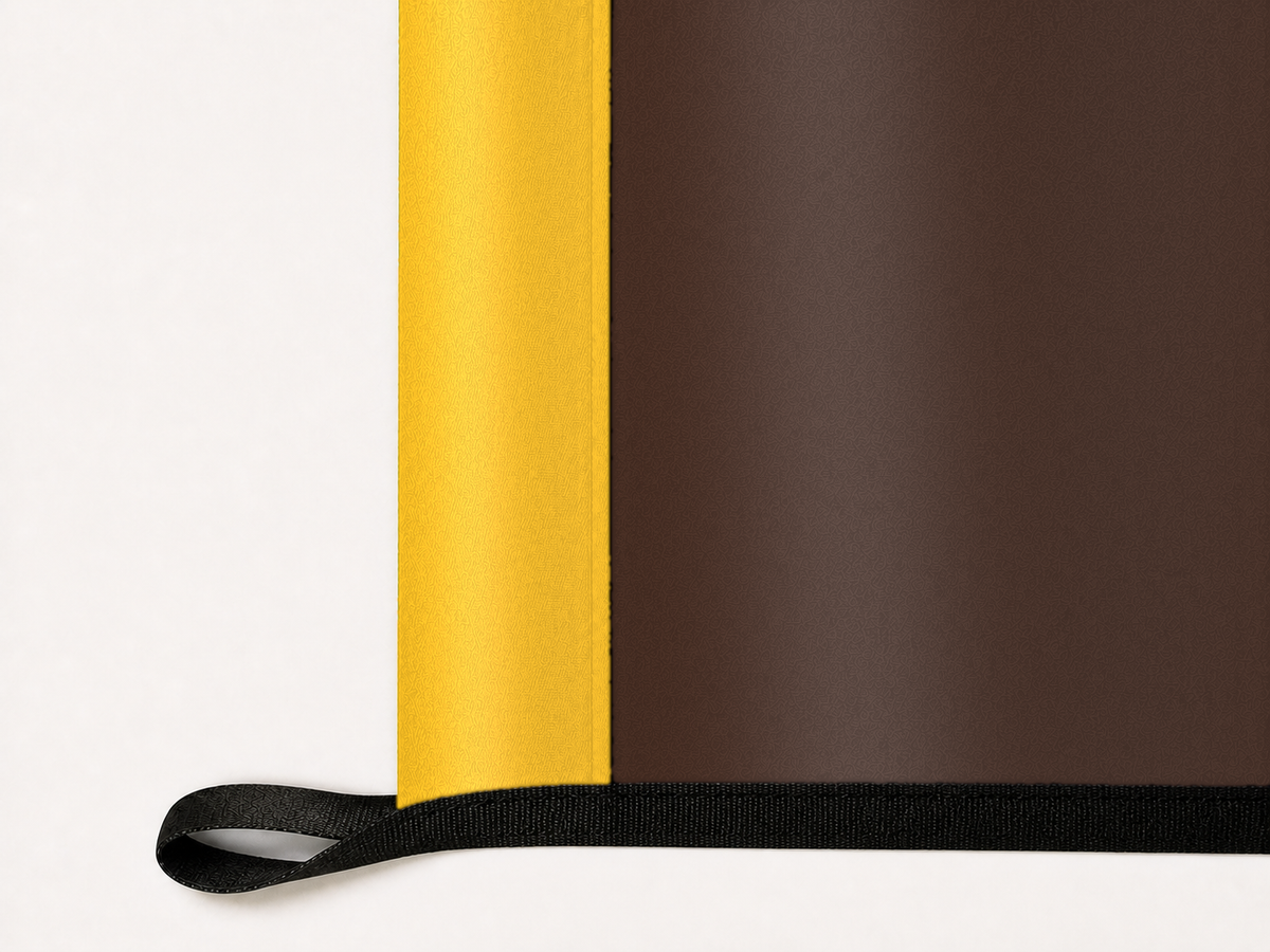 Wyoming Cowboys Authentic Gameday Flag underside and personalization construction view — continuous restrained woven-satin Wyoming Cowboys Accent header, textured Wyoming Cowboys Primary face, lower black loop and perimeter webbing — source_sha256=7d7260654263e360d219a51fe0f109fba2c409e48026a1dfb5a5ff7a3e71c254