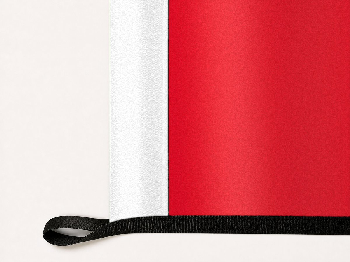 Detroit Red Wings Authentic Gameday Flag underside and personalization construction view — continuous restrained woven-satin Detroit Red Wings Accent header, textured Detroit Red Wings Primary face, lower black loop and perimeter webbing — source_sha256=fc67292465a9b15cad644c8b0369ec63a5a707bb49fe2378481fe6bc2a778b4d