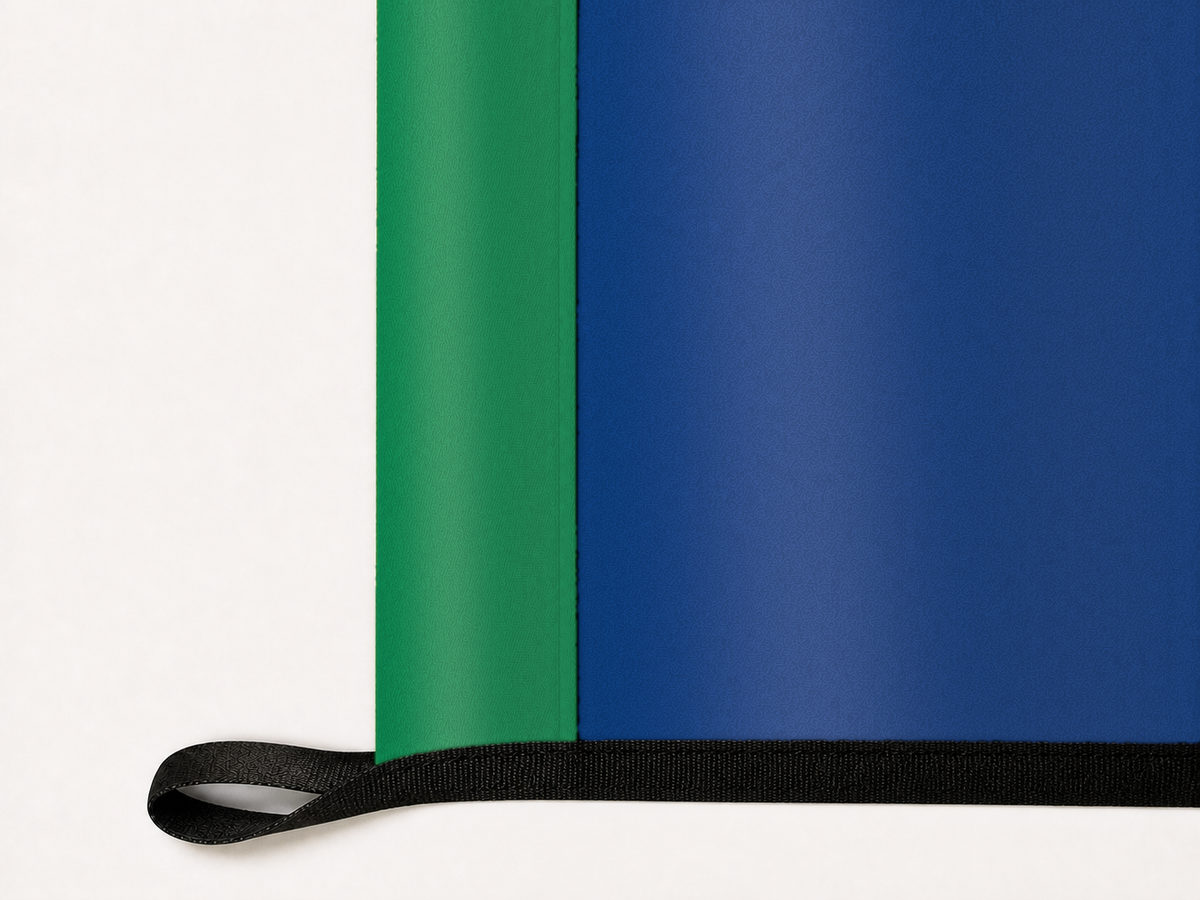 Vancouver Canucks Authentic Gameday Flag underside and personalization construction view — continuous restrained woven-satin Vancouver Canucks Accent header, textured Vancouver Canucks Primary face, lower black loop and perimeter webbing — source_sha256=8ba92ab3a495bf63a6dfd11d847a9ceb057e121ba6a4a1f72be8f6770bdeff8f