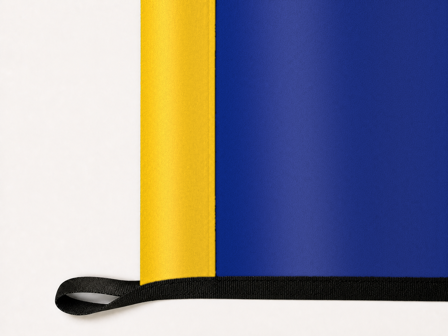Montana State Flag Authentic Gameday Flag underside and personalization construction view — continuous restrained woven-satin Montana State Flag Accent header, textured Montana State Flag Primary face, lower black loop and perimeter webbing — source_sha256=e9188cc64172343b2acd7976cf63026943a304c7b8cae376aababb08e6ea8c03