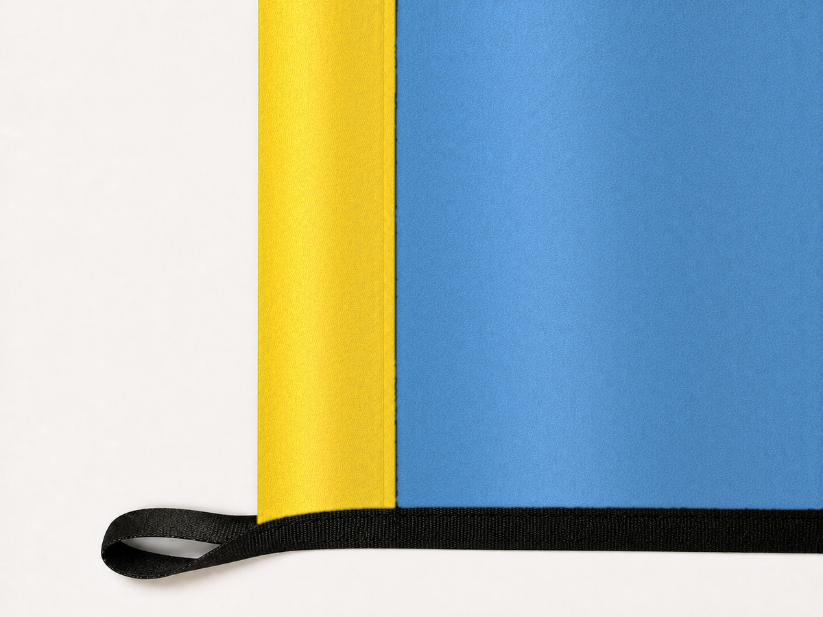 Chicago Sky Authentic Gameday Flag underside and personalization construction view — continuous restrained woven-satin Chicago Sky Accent header, textured Chicago Sky Primary face, lower black loop and perimeter webbing — source_sha256=ab41b33ab951276614be28645d4913d14205ff5cf9be2adba0f1474fc2091ab6