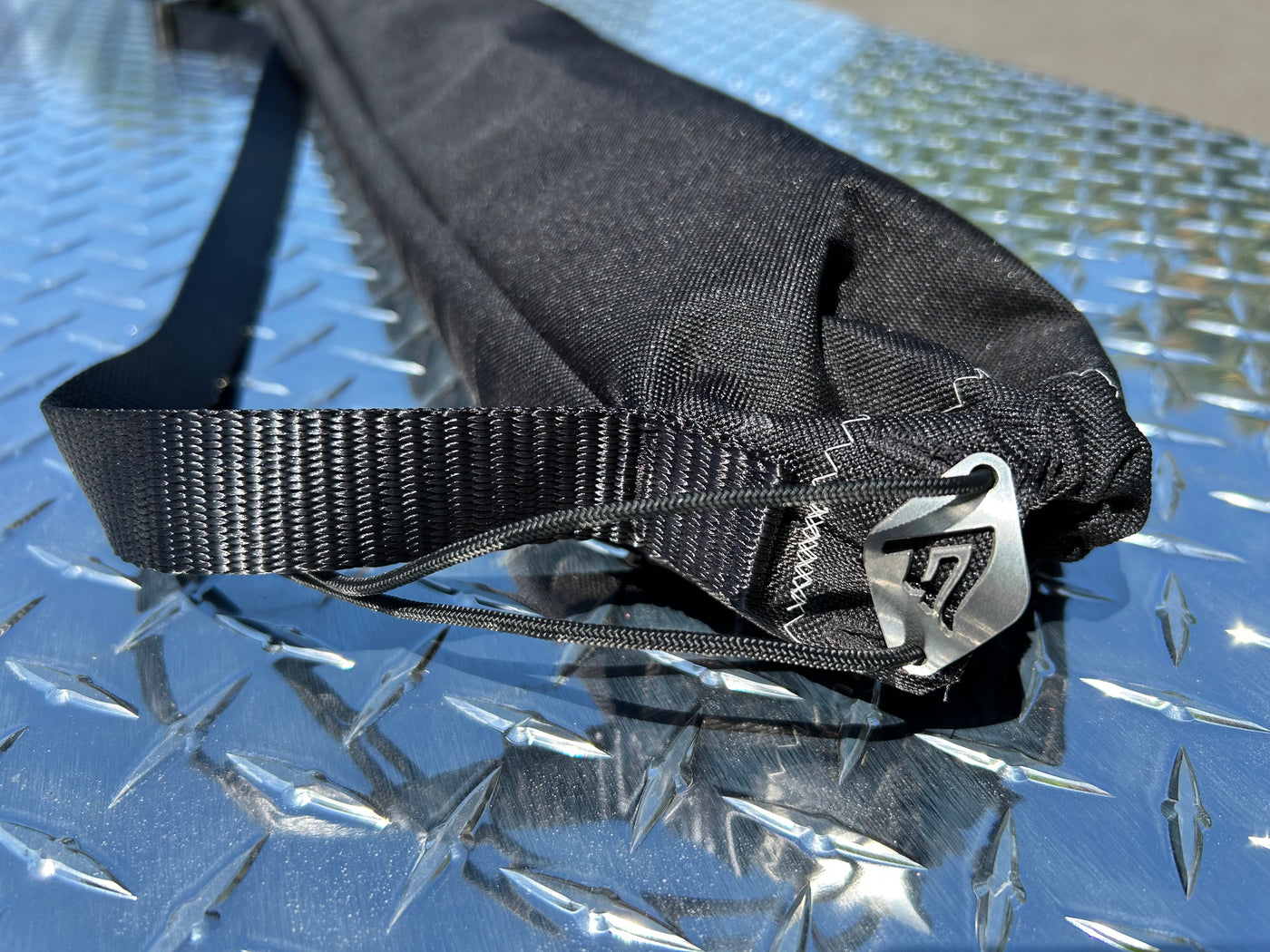 Black Ottertex carry bag with stainless Gflag Diamond pull-string enclosure detail