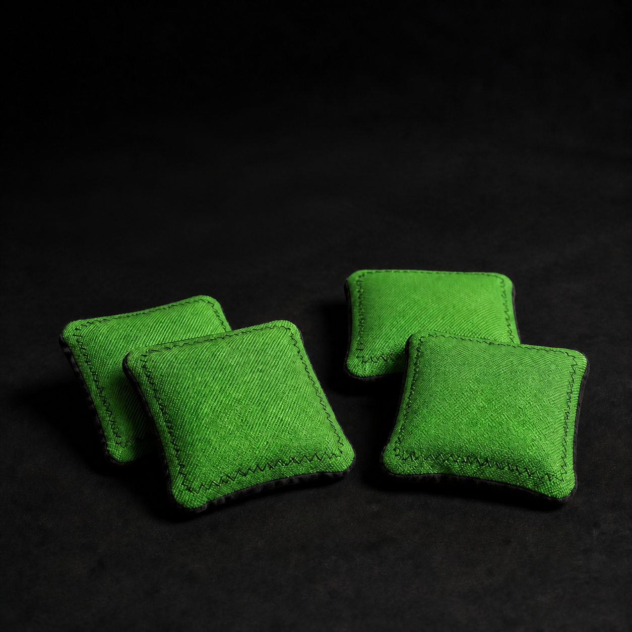 Set of four chartreuse three-inch cornhole bags for the compact Couch Cornhole Board